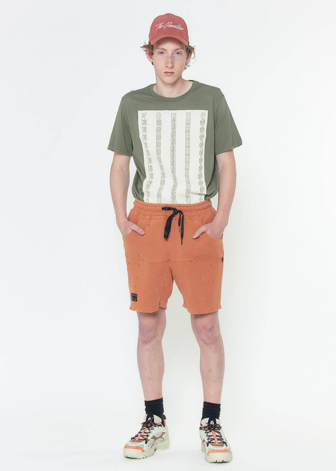 Konus Men's Garment Dyed French Terry Shorts in Orange by Shop at Konus